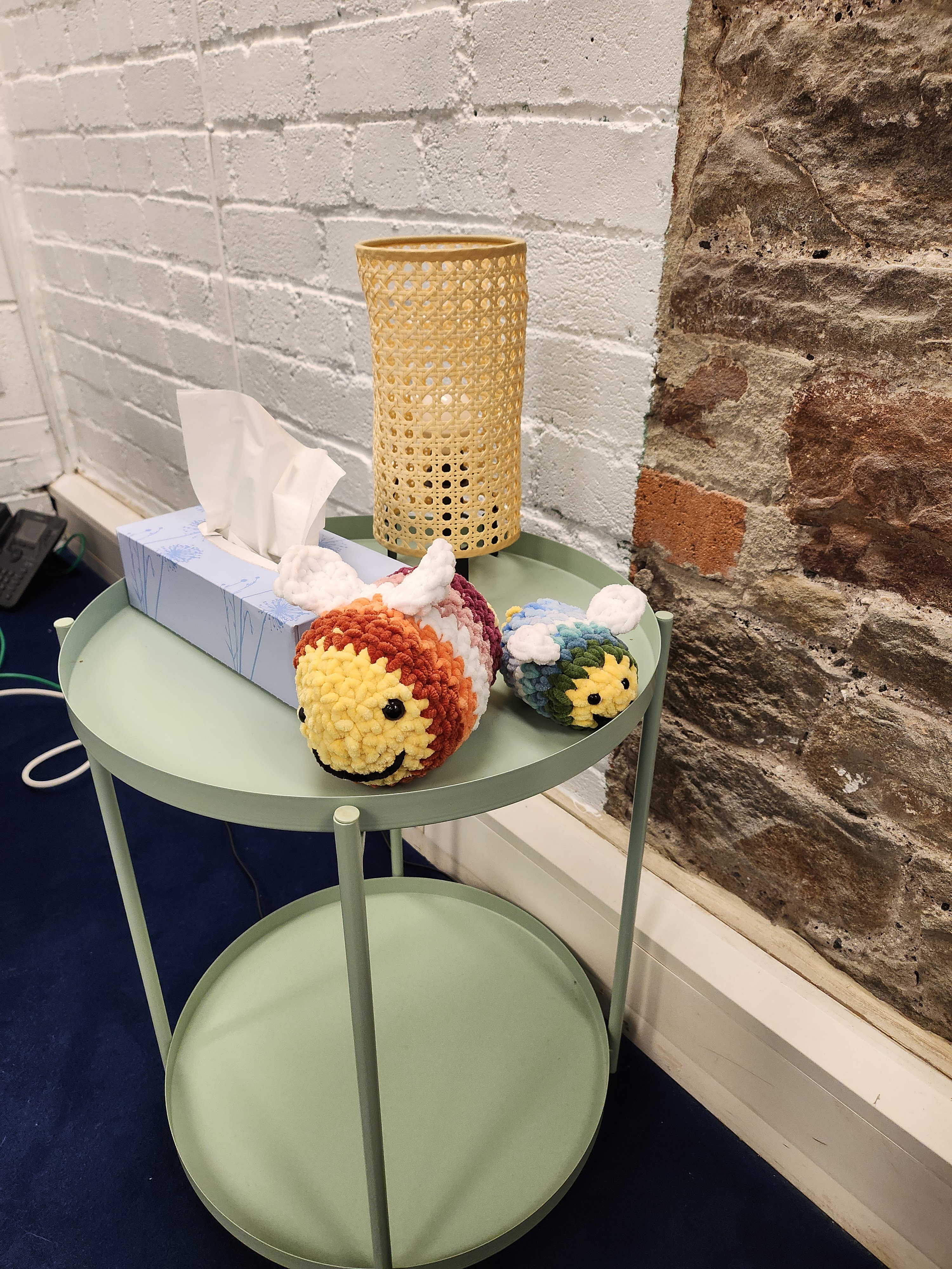 Comfort bees Crocheted bees adorn a side table. Something to hold when talking about challenging things.