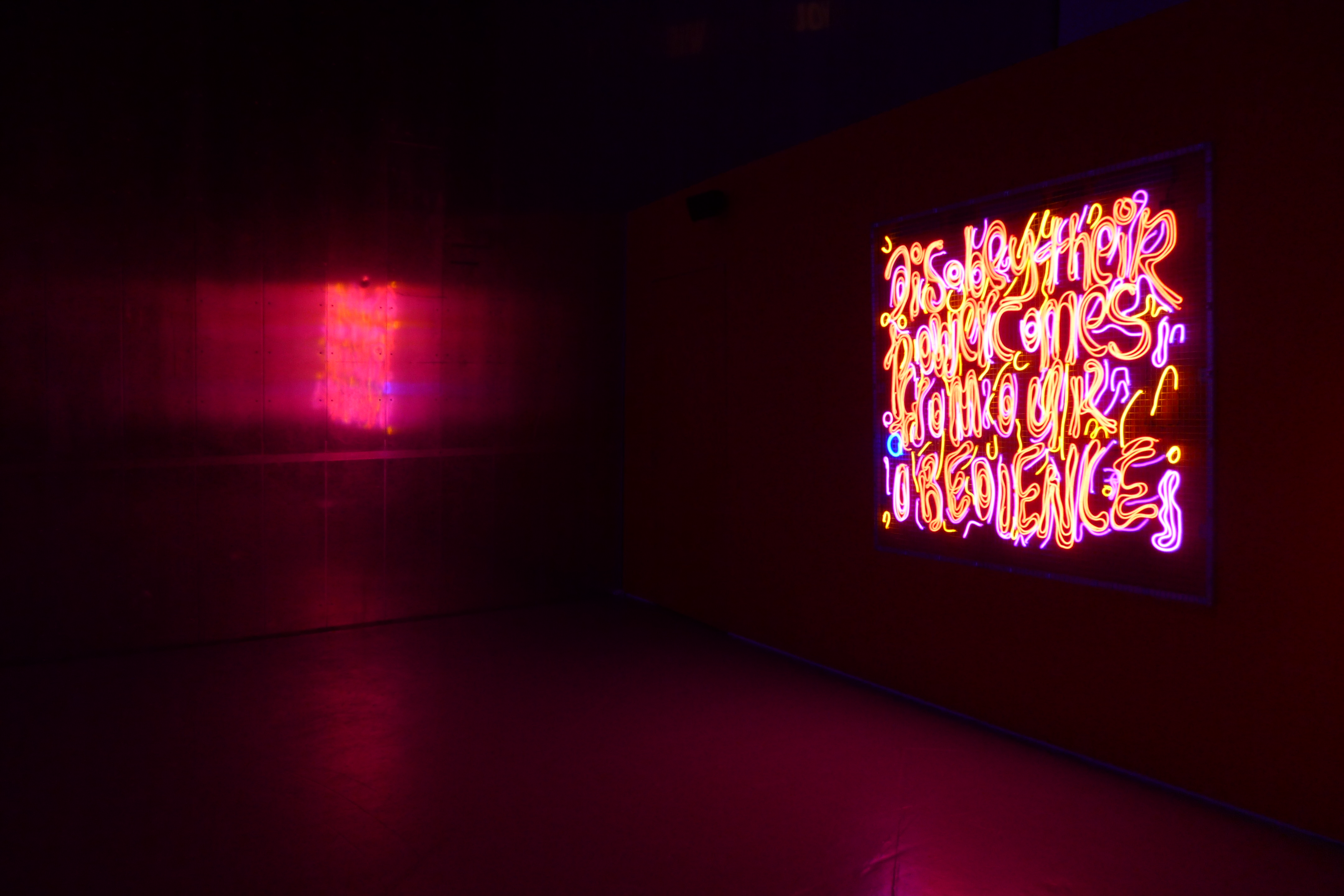 A picture of a art exhibition displaying a quote '