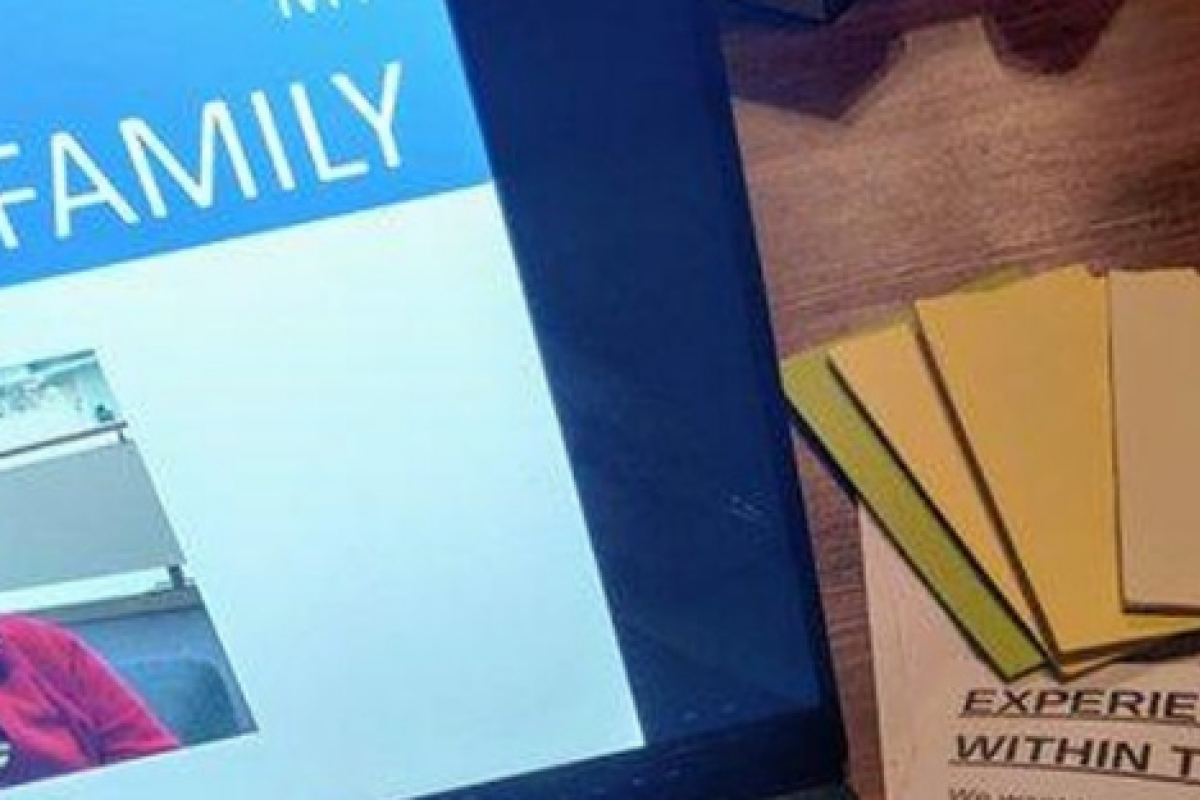 Computer screen showing a Community Reporter story. Next to it are post-its and a fact sheet.